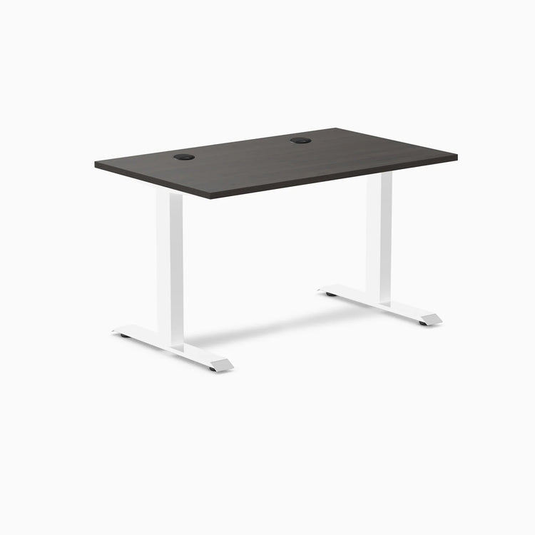 Desky Zero laminate office desk with burnished wood top, white steel frame, and two grommets.