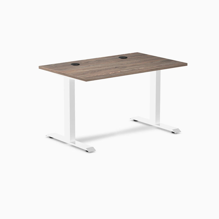Desky Zero fixed height office desk with natural walnut laminate top, white steel frame, and grommets.