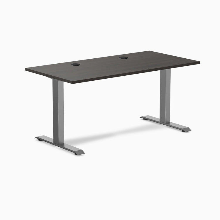Desky Zero fixed height office desk with burnished wood laminate top, grommets, and space gray steel frame.