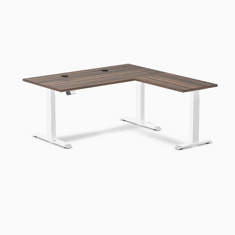 Desky L-Shape Laminate Sit Stand Desk with Jarrah Legno top, white legs, and grommets.