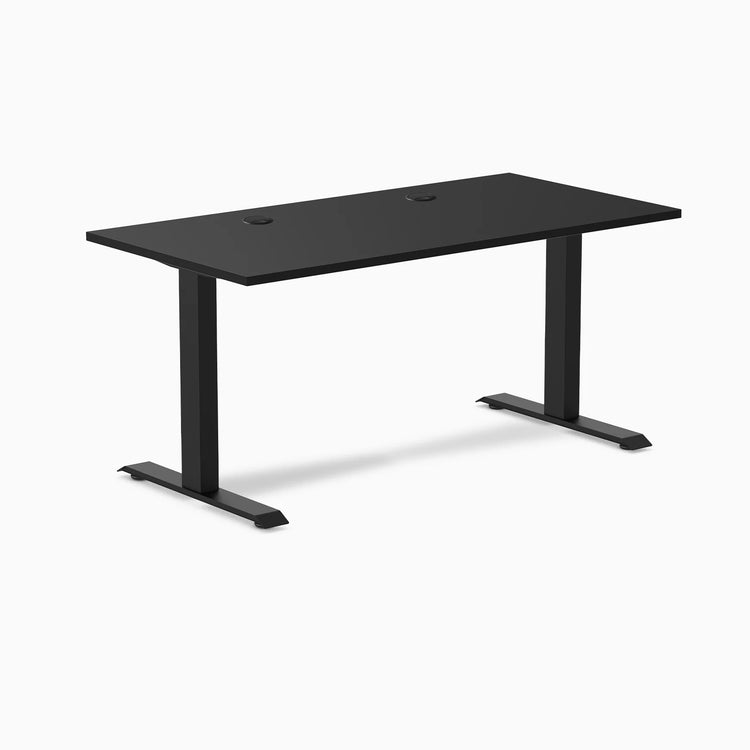 Desky Zero fixed height office desk, 59x29.5 inch black laminate top with grommets and matte black steel frame.