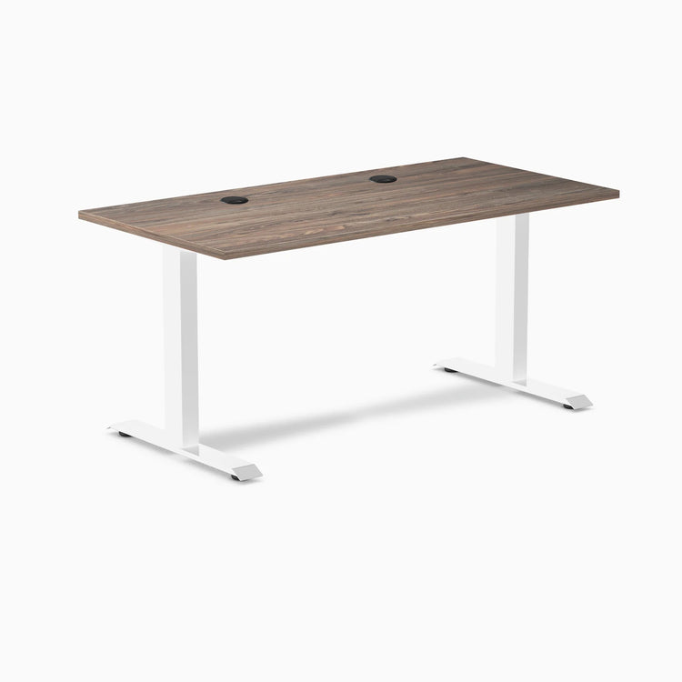 Desky Zero fixed height office desk with natural walnut laminate top, white steel frame, and two grommets.