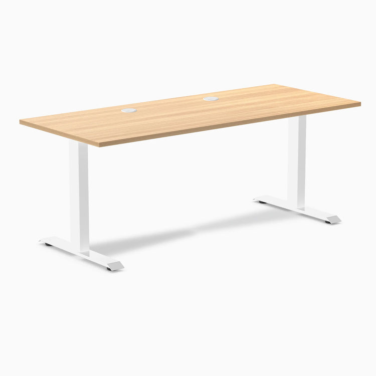 Desky Zero fixed height office desk with Sublime Teak laminate top, white steel frame, and two grommets.