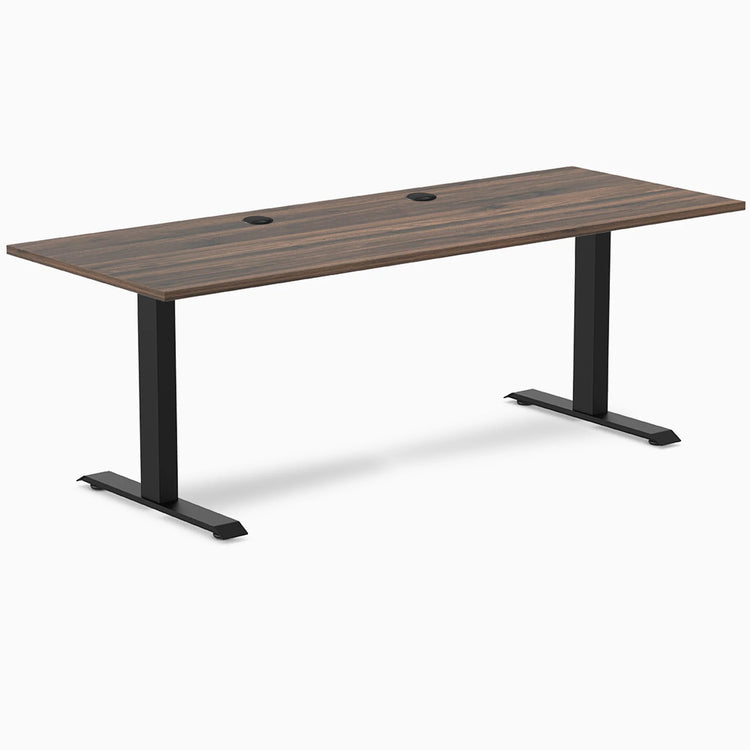 Desky Zero fixed-height office desk with Jarrah Legno laminate top, black steel frame, and two grommets.