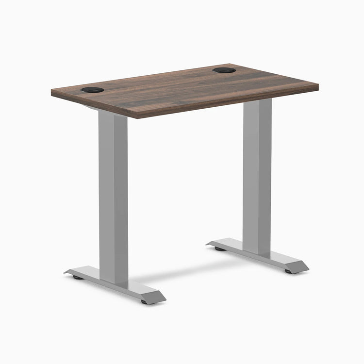 Desky Zero Mini desk with Jarrah Legno top, gray fixed-height legs, and two grommets.