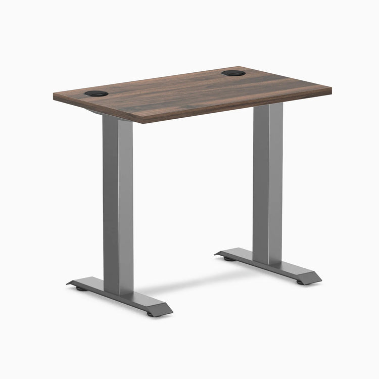 Desky Zero Mini fixed-height desk with Jarrah Legno top, Space Gray legs, and grommets.