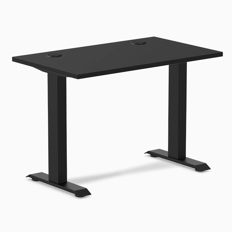 Desky Zero Mini fixed-height desk, 40x24 inch matte black top with grommets, and matte black legs.