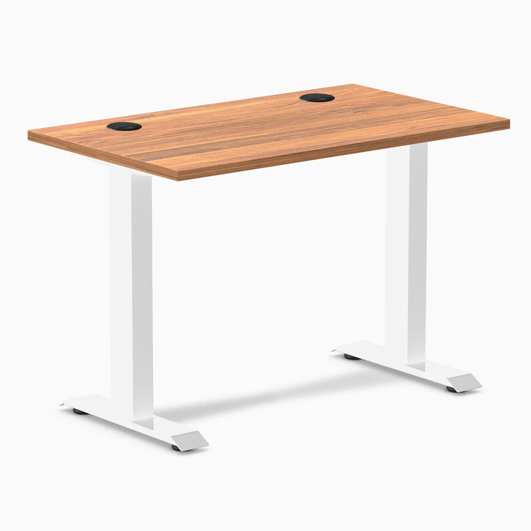 Desky Zero Mini sit-stand desk, Prime Oak 40x24 inch top with grommets, white fixed-height legs.