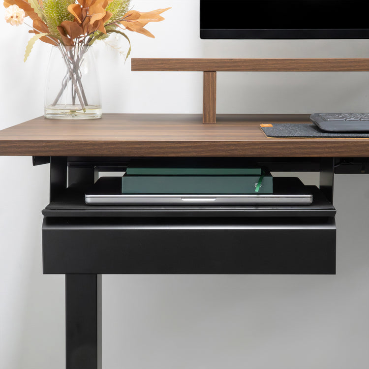Black steel Desky under desk drawer, holding a laptop and notebook, mounted beneath a wood desk.