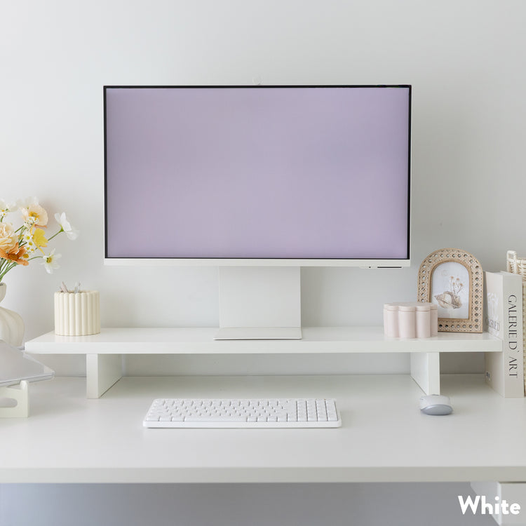 White Desky Minimal Monitor Stand made of melamine, elevating a monitor on a clean, organized desk.