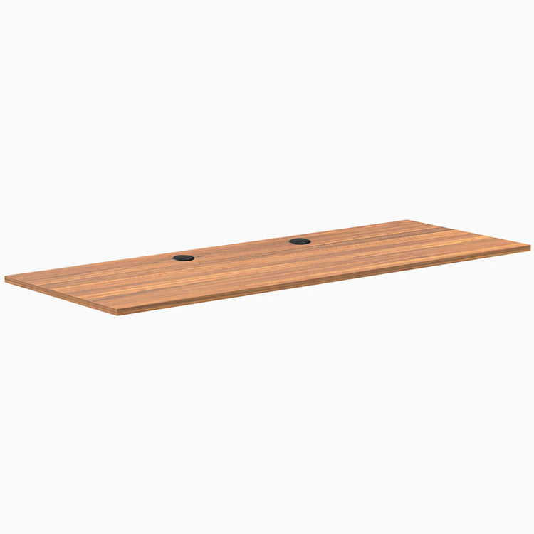 Prime Oak laminate desk top, 78.7" x 29.5", with two black grommets for cable management.