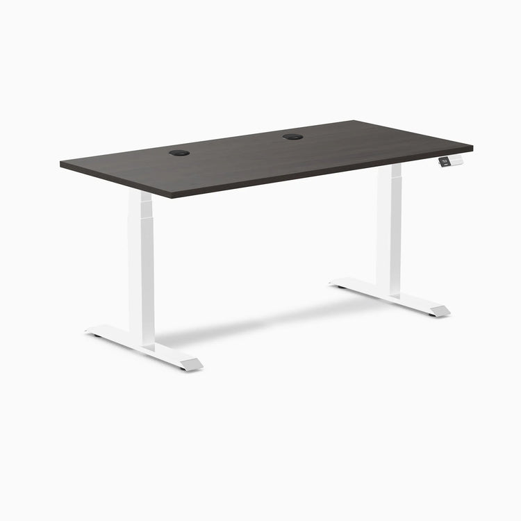 Burnished wood laminate sit-stand desk, 59.1x29.5 inches, with grommets and white frame.