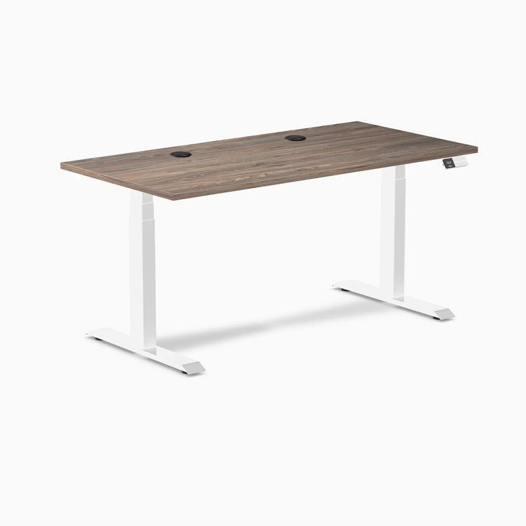 Desky Dual sit-stand desk with natural walnut laminate top, white frame, and two grommets.