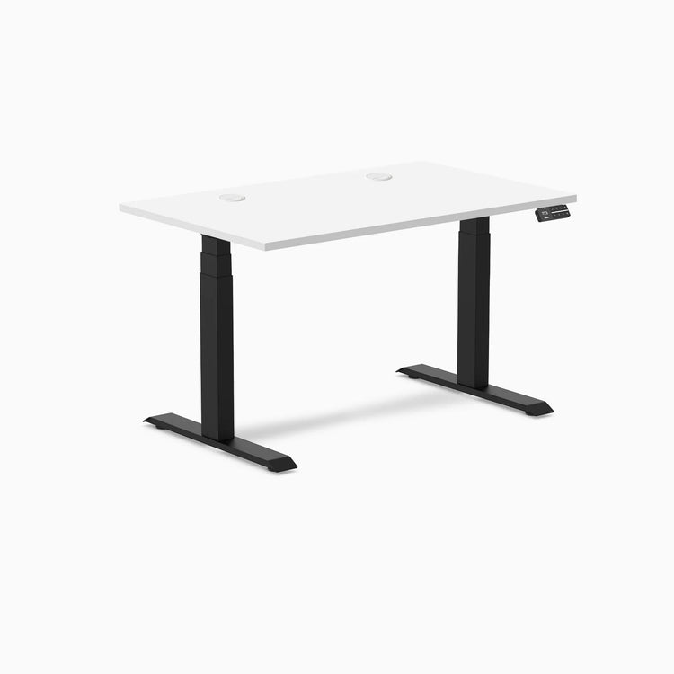 Desky Dual sit-stand desk with white laminate top, black frame, and two grommets.
