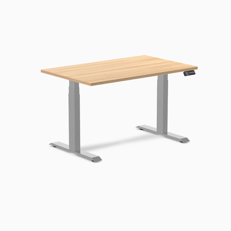 Desky Dual Custom Laminate Sit Stand Desk with natural wood-look top and silver adjustable legs.