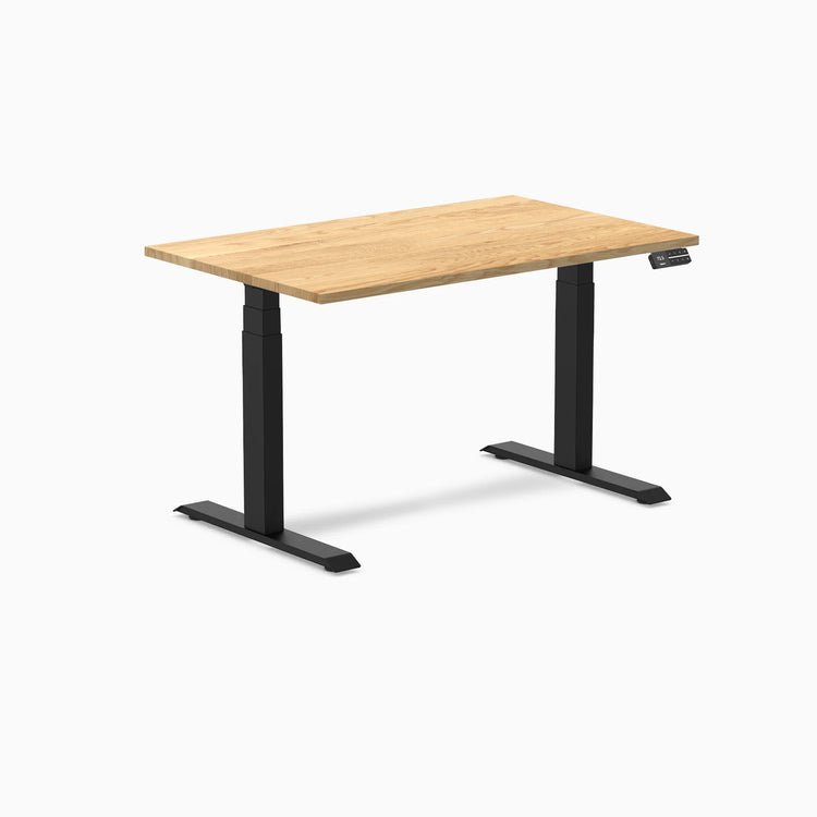 Desky Dual 48x30 inch White Oak hardwood sit-stand desk with matte black legs and control panel.