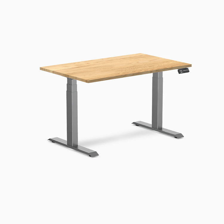Desky Dual 48x30 inch White Oak hardwood sit-stand desk with Space Gray legs and control panel.