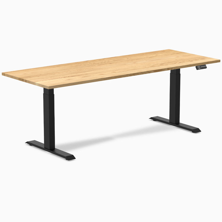 Desky Dual Hardwood Sit Stand Desk with White Oak 80x30 inch top and Matte Black legs.