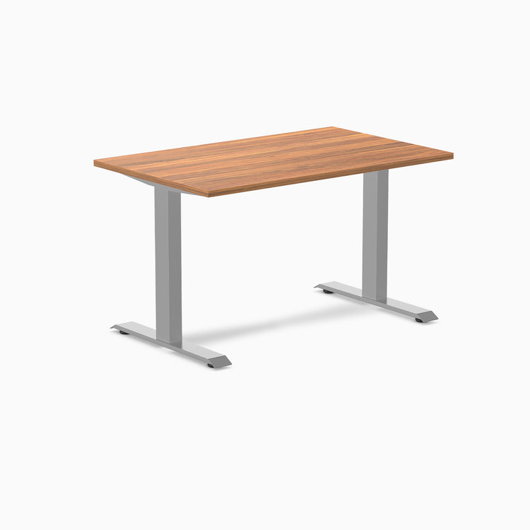 Desky Zero fixed height office desk with a natural wood laminate top and silver steel frame.