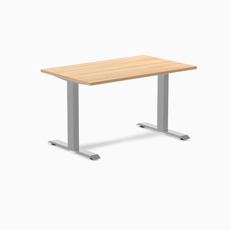Desky Zero laminate office desk with a light wood top and silver steel frame.