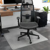 Translucent PVC Desky Chair Mat with key shape design under a black office chair on carpet.