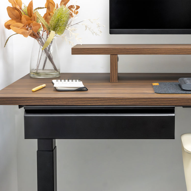 Black steel Desky Under Desk Drawer mounted beneath a dark wood desk, designed for sit-stand desks.