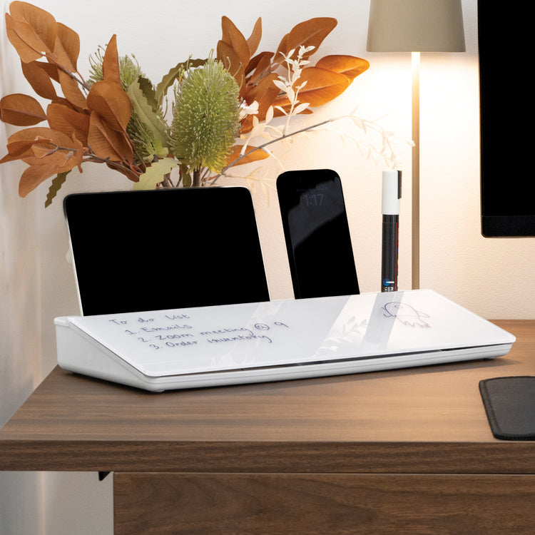 White Desky Desktop Whiteboard with notes, a tablet, smartphone, and marker on a wooden desk.