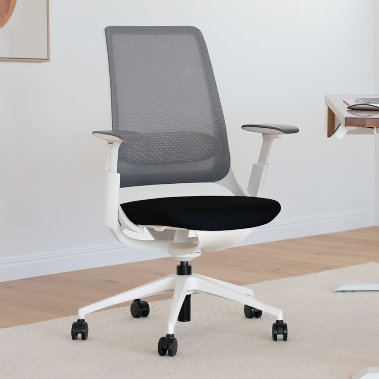 Desky Pulse ergonomic desk chair with white frame, gray mesh back, black seat, and 4D adjustable armrests.
