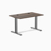 Desky Zero fixed-height office desk with Jarrah Legno laminate top, Space Gray steel frame, and grommets.