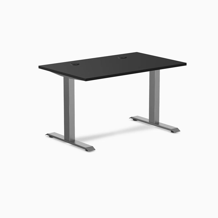 Desky Zero fixed height office desk with black laminate top, grommets, and space gray steel frame.