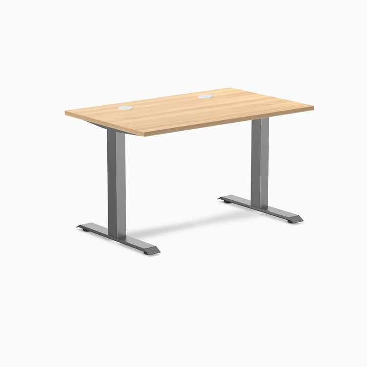 Desky Zero fixed height office desk with Sublime Teak laminate top, Space Gray steel frame, and grommets.