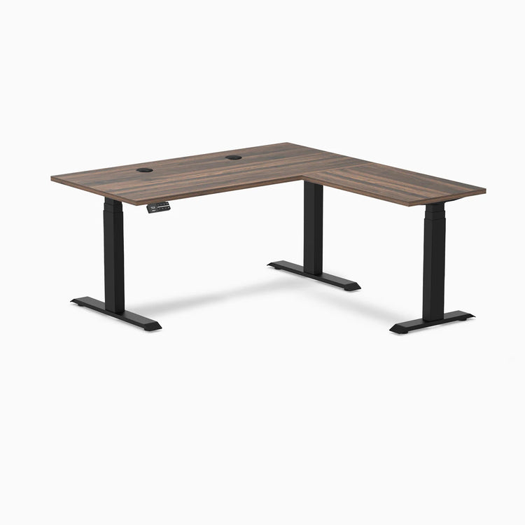 Desky L-Shape Laminate Sit Stand Desk in Jarrah Legno with Matte Black legs and grommets.