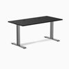 Desky Zero fixed height office desk with black laminate top, Space Gray steel frame, and two grommets.