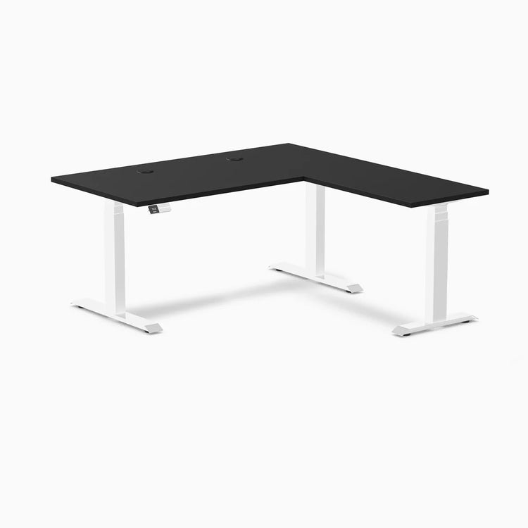Desky L-Shape Laminate Sit Stand Desk with black top, white frame, and grommets.