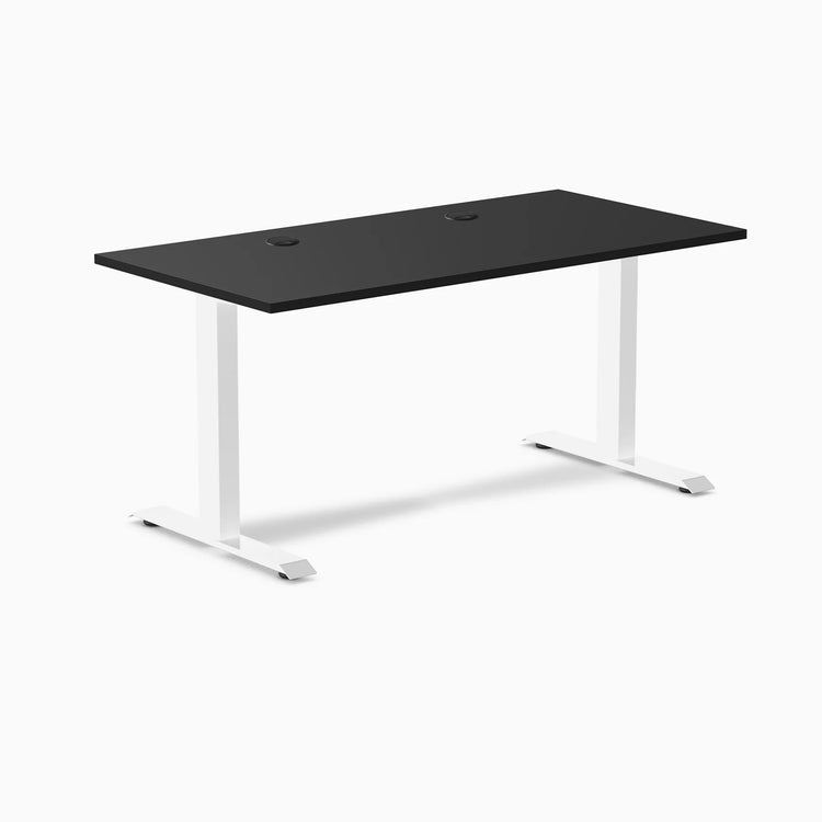 Desky Zero fixed height office desk with black laminate top, white steel frame, and two grommets.