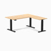 Desky L-Shape Laminate Sit Stand Desk in Sublime Teak with Matte Black frame and grommets.