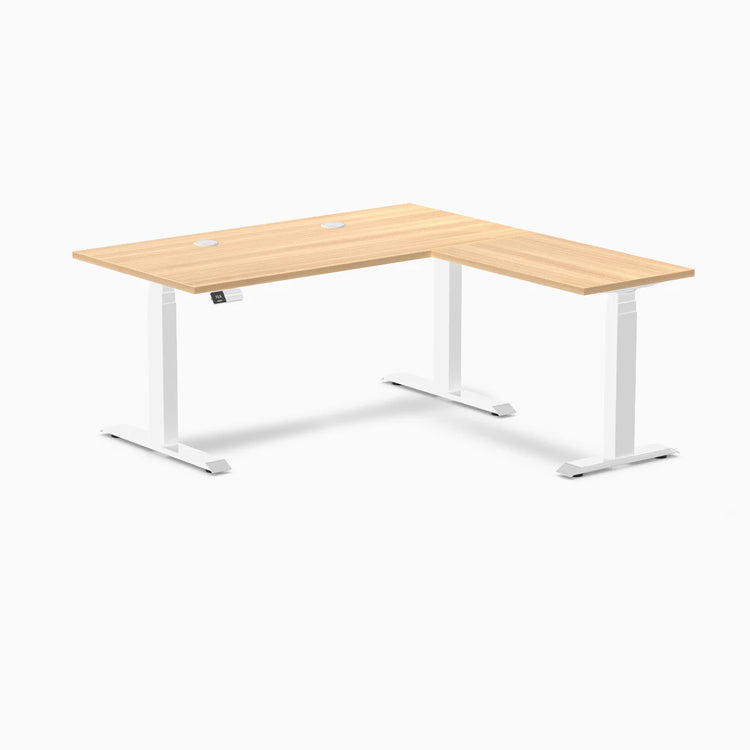 Sublime Teak L-Shape Laminate Sit Stand Desk with white frame and grommets.