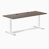Desky Zero fixed height office desk with Jarrah Legno laminate top, white steel frame, and two grommets.