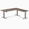 Desky L-Shape Laminate Sit Stand Desk in Jarrah Legno with Space Gray legs and grommets.