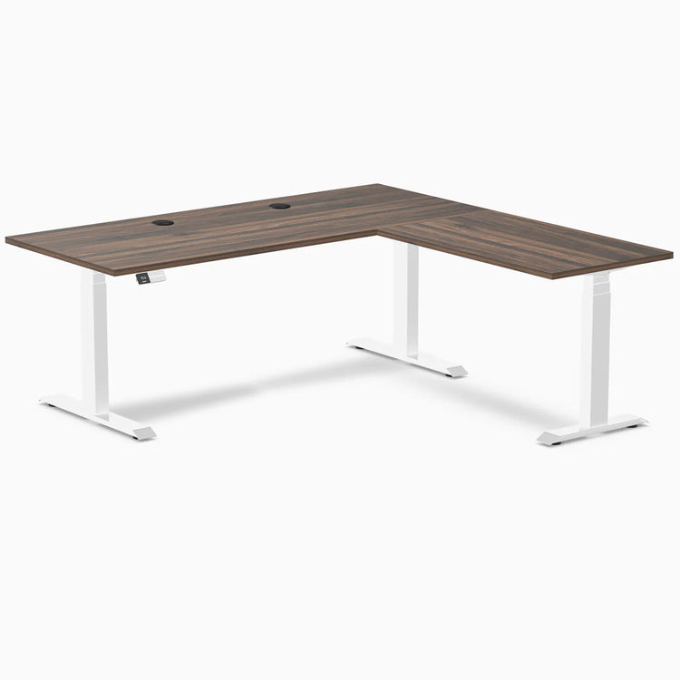 Desky L-Shape Laminate Sit Stand Desk in Jarrah Legno with white legs and grommets.