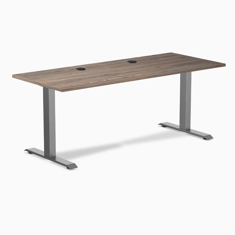 Desky Zero laminate office desk with natural walnut top, space gray steel frame, and grommets.