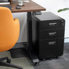 Black Desky 3-drawer mobile filing cabinet with rounded edges, key in top lock, and casters under a wooden desk.