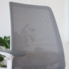 Close-up of a Desky Pulse supportive desk chair with a grey mesh back and white frame.