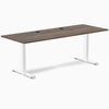 Desky Zero office desk with Jarrah Legno laminate top, white steel frame, and two grommets.