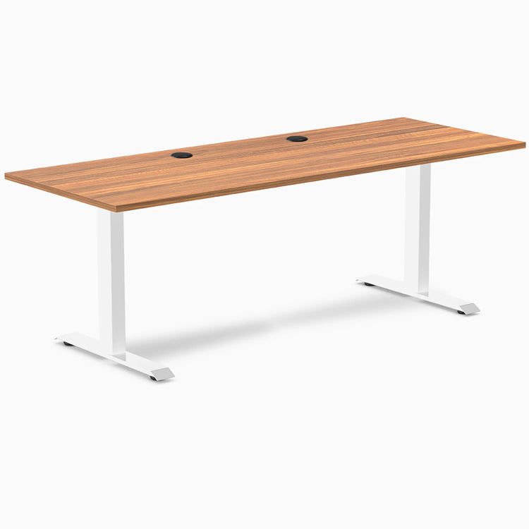 Desky Zero fixed height office desk with Prime Oak laminate top, 78.7x29.5 inches, white steel frame, and grommets.