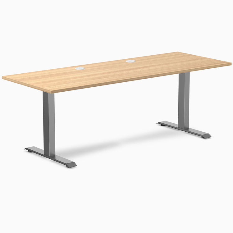 Desky Zero fixed height office desk with Sublime Teak laminate top, Space Gray steel frame, and grommets.