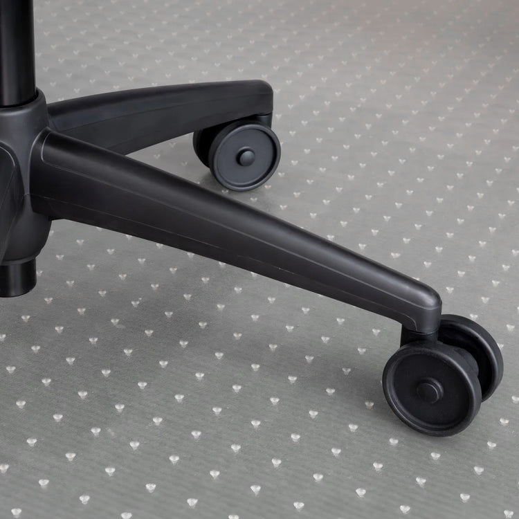 Translucent PVC Desky Chair Mat with a subtle heart pattern under a black office chair base.