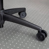 Translucent PVC Desky Chair Mat with a subtle heart pattern under a black office chair base.