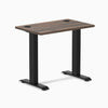 Desky Zero Mini fixed-height desk with Jarrah Legno 32x20 inch top, grommets, and matte black legs.