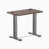 Desky Zero Mini fixed-height desk with Jarrah Legno top, Space Gray legs, and grommets.
